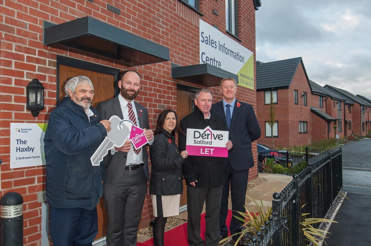 Salford City Mayor Paul Dennett and Derive directors, Councillor John Merry and Councillor Tracy Kelly outside a new home